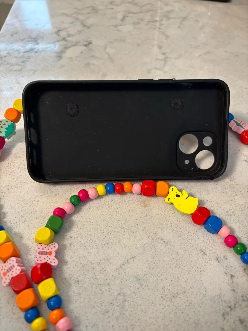 iPhone 15 case with handle and beaded strap